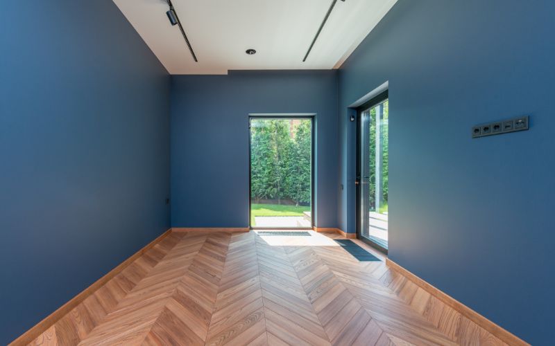 an empty room featuring deep blue walls